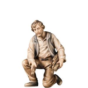 A-Kneeling farmer with firewood